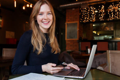 A woman who is happy that QuickBooks works more naturally with a custom app